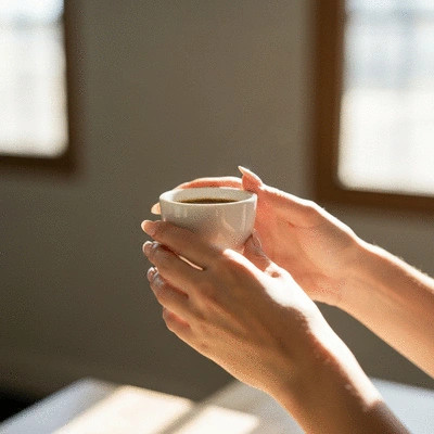 Person enjoying a specialty coffee tasting experience